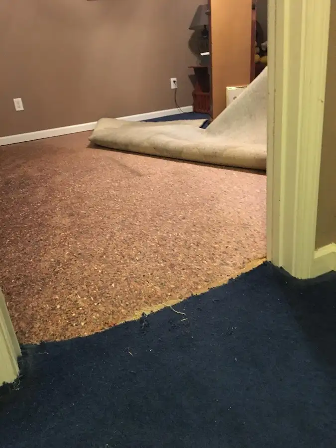 Carpet pad removal revealing water damage during Drying & Dehumidification in Rio Linda